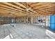Interior of home under construction with exposed framing, ceiling and concrete floor at 3449 Companero Entra, Hernando Beach, FL 34607