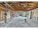 Interior of home under construction with exposed framing, ceiling and concrete floor at 3449 Companero Entra, Hernando Beach, FL 34607