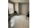 Bright room featuring tile floors, a ceiling fan, and a window with blinds at 3801 Kimball Ave, Tampa, FL 33614