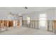 Spacious living room featuring concrete floors, natural light, and unfinished walls at 4488 Bimini Dr, Hernando Beach, FL 34607