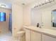 Bathroom with shower/tub combination, white vanity, and plenty of natural light at 469 Fairbanks Rd, Spring Hill, FL 34608