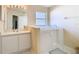 Bright bathroom featuring a walk-in tub, and a single sink vanity with a decorative countertop at 469 Fairbanks Rd, Spring Hill, FL 34608