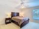 Well-lit bedroom with a platform bed, and side tables with lamps on each side at 469 Fairbanks Rd, Spring Hill, FL 34608