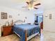 This bedroom has a comfortable bed, ceiling fan, and side tables, creating a tranquil personal space at 469 Fairbanks Rd, Spring Hill, FL 34608