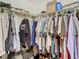 Organized walk-in closet with ample hanging space and various clothing items at 469 Fairbanks Rd, Spring Hill, FL 34608