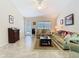 Large living room features tile floors and natural light at 469 Fairbanks Rd, Spring Hill, FL 34608