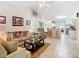 Open floorplan living room with tile floors and adjacent to kitchen and dining areas at 469 Fairbanks Rd, Spring Hill, FL 34608