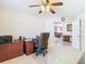 This home office features an executive desk and chair and is enhanced by a ceiling fan and neutral decor at 469 Fairbanks Rd, Spring Hill, FL 34608