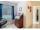 This home office features an antique writing desk near a window with a view and natural light at 469 Fairbanks Rd, Spring Hill, FL 34608