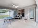 Covered patio with ceiling fan, table, and chairs at 469 Fairbanks Rd, Spring Hill, FL 34608