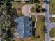 An aerial view of a dark roof and well maintained lawn in a close knit neighborhood at 5050 Limestone Dr, Port Richey, FL 34668