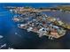 Stunning aerial view of waterfront homes with docks and boat access and the beautiful blue water at 5050 Limestone Dr, Port Richey, FL 34668