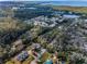 A birds-eye view shows the property's location within a lush, tree-filled neighborhood near the bay at 5050 Limestone Dr, Port Richey, FL 34668