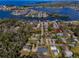 An aerial view of the community featuring water access for boating and lots of lush trees at 5050 Limestone Dr, Port Richey, FL 34668