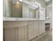 Bathroom featuring double sinks, a vanity, and a tile floor at 5050 Limestone Dr, Port Richey, FL 34668