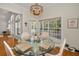 Cozy breakfast nook featuring bright windows and decorative chandelier lighting at 5050 Limestone Dr, Port Richey, FL 34668