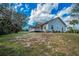 Charming home with lush green lawn and mature landscaping adding to the property's appeal and privacy at 5050 Limestone Dr, Port Richey, FL 34668