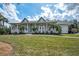 Stunning home with a covered porch, beautiful greenery and great curb appeal at 5050 Limestone Dr, Port Richey, FL 34668
