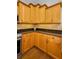Close-up of the kitchen with granite countertops and wood cabinets at 5050 Limestone Dr, Port Richey, FL 34668