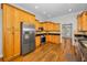 Modern kitchen with stainless steel appliances and ample cabinet space at 5050 Limestone Dr, Port Richey, FL 34668