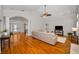 Expansive living room featuring an open floor plan and gleaming hardwood floors at 5050 Limestone Dr, Port Richey, FL 34668