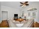 Comfortable living room with a neutral-toned sectional and vaulted ceiling at 5050 Limestone Dr, Port Richey, FL 34668