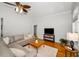 Cozy living room with a large sofa, television, and ample natural light at 5050 Limestone Dr, Port Richey, FL 34668