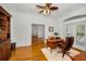 Office features hardwood floors, ceiling fan, and outdoor access at 5050 Limestone Dr, Port Richey, FL 34668