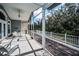 Spacious screened patio with stylish furniture, offering an inviting outdoor living area with scenic views at 5050 Limestone Dr, Port Richey, FL 34668