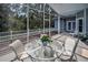 Tranquil screened patio featuring a glass table and chairs, complemented by scenic nature views at 5050 Limestone Dr, Port Richey, FL 34668