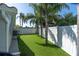 Spacious backyard with manicured lawn and white privacy fence at 5061 Ensign Loop, New Port Richey, FL 34652
