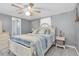 Relaxing bedroom featuring soft lighting, a ceiling fan, and soothing color palette at 5061 Ensign Loop, New Port Richey, FL 34652