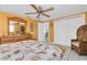 Bedroom with warm, yellow walls and large white closet at 5061 Ensign Loop, New Port Richey, FL 34652
