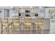 Well-equipped kitchen with stainless steel appliances, ample cabinetry, and a spacious island with bar stool seating at 5061 Ensign Loop, New Port Richey, FL 34652