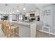 Bright kitchen with a granite island, stainless steel appliances, and ample cabinet space at 5061 Ensign Loop, New Port Richey, FL 34652