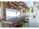 Enjoy the outdoor bar area complete with bar seating and a true Florida surf shack vibe at 5061 Ensign Loop, New Port Richey, FL 34652