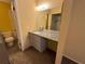 Bathroom featuring a granite vanity, mirror, and tile floors at 5231 Corvette Dr, Tampa, FL 33624