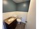 Well-lit half bathroom with a vanity and updated fixtures at 5231 Corvette Dr, Tampa, FL 33624