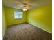 Spacious bedroom with a ceiling fan and window that provides plenty of natural light at 5231 Corvette Dr, Tampa, FL 33624