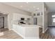 Bright, updated kitchen with white countertops, stainless steel appliances, and a convenient breakfast bar at 5357 Greystone Dr, Spring Hill, FL 34609