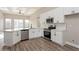 Well-appointed kitchen showcasing white cabinetry, stainless steel appliances, and ample countertop space at 5357 Greystone Dr, Spring Hill, FL 34609