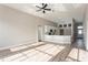 Bright, open living space with a modern ceiling fan, seamlessly connecting the kitchen and living areas at 5357 Greystone Dr, Spring Hill, FL 34609