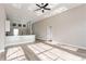 Open-concept living area with modern lighting fixtures connecting kitchen and living room at 5357 Greystone Dr, Spring Hill, FL 34609