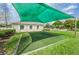 Community green space with shade and a level turf area for various activities and enjoyment at 5903 War Admiral Dr, Wesley Chapel, FL 33544