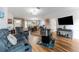 Inviting living room with a large sofa, wood flooring, and open layout to the kitchen at 610 Cobia Way, Oldsmar, FL 34677