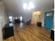 Bright living room featuring wood-look flooring and an open concept design at 610 Cobia Way, Oldsmar, FL 34677