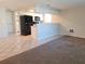 Open-concept kitchen featuring modern appliances and an eat-in bar area for casual dining at 6301 Baldwyn Ave, New Port Richey, FL 34653