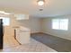 Modern kitchen featuring white cabinets, granite countertops, and stainless steel appliances at 6301 Baldwyn Ave, New Port Richey, FL 34653