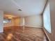 Open-concept living room featuring hardwood floors and lots of natural light throughout at 6301 Baldwyn Ave, New Port Richey, FL 34653