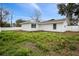 Expansive backyard with new fence, offering privacy and potential for landscaping and recreation at 6358 Dakota Dr, Brooksville, FL 34602